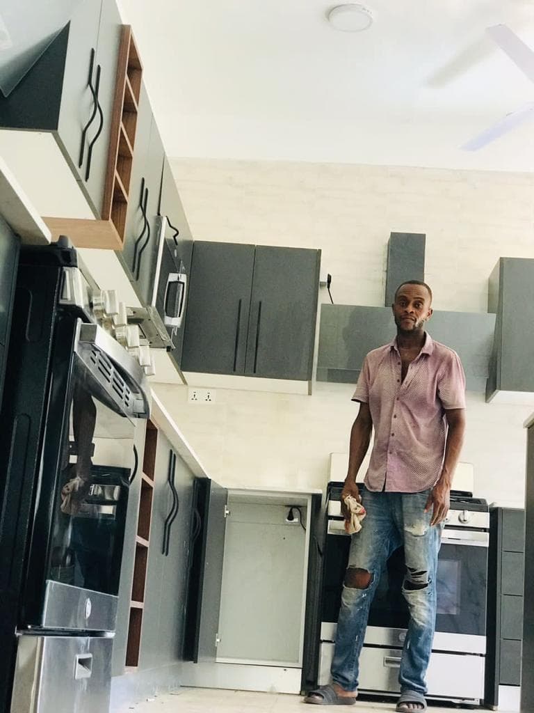 Commercial bar counter with wood shelving — Tech1 Wood Works Ghana